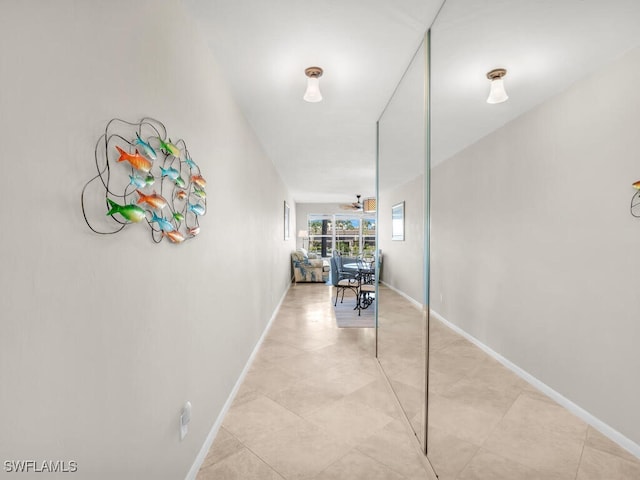 900 Collier Ct Unit 106, Marco Island, FL 34145 - hall featuring baseboards and light tile patterned floors
