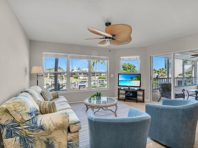 900 Collier Ct Unit 106, Marco Island, FL 34145 - living area featuring a ceiling fan and baseboards