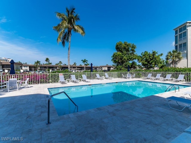900 Collier Ct Unit 106, Marco Island, FL 34145 - pool with a patio area and fence