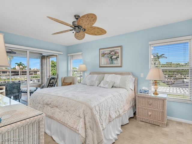 900 Collier Ct Unit 106, Marco Island, FL 34145 - carpeted bedroom featuring access to exterior, a ceiling fan, baseboards, and multiple windows