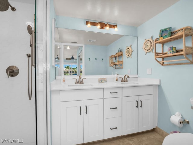 900 Collier Ct Unit 106, Marco Island, FL 34145 - bathroom featuring visible vents, a sink, double vanity, and tiled shower