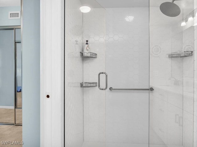 900 Collier Ct Unit 106, Marco Island, FL 34145 - bathroom featuring visible vents and a stall shower