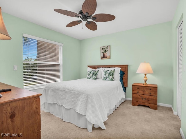900 Collier Ct Unit 106, Marco Island, FL 34145 - bedroom with a closet, light carpet, a ceiling fan, and baseboards