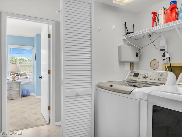 900 Collier Ct Unit 106, Marco Island, FL 34145 - washroom with washing machine and clothes dryer, laundry area, and baseboards