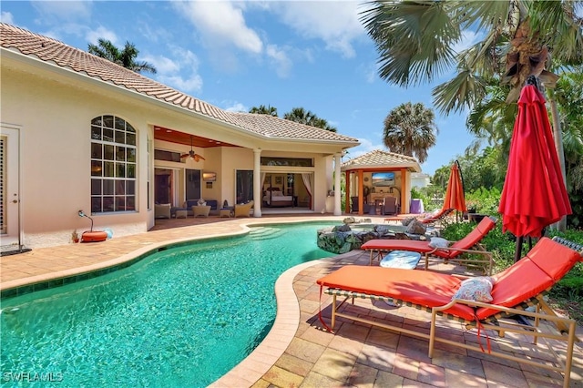 2363 Crayton Rd, Naples, FL 34103 - swimming pool with a gazebo, a patio, outdoor lounge area, and a ceiling fan