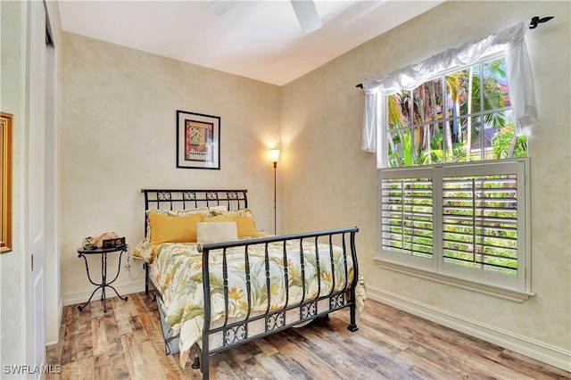 2363 Crayton Rd, Naples, FL 34103 - bedroom featuring wood finished floors, baseboards, and ceiling fan