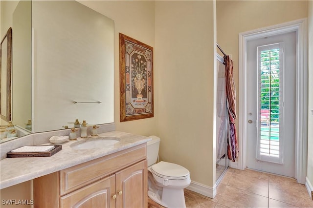 2363 Crayton Rd, Naples, FL 34103 - full bath with vanity, toilet, baseboards, and tile patterned flooring