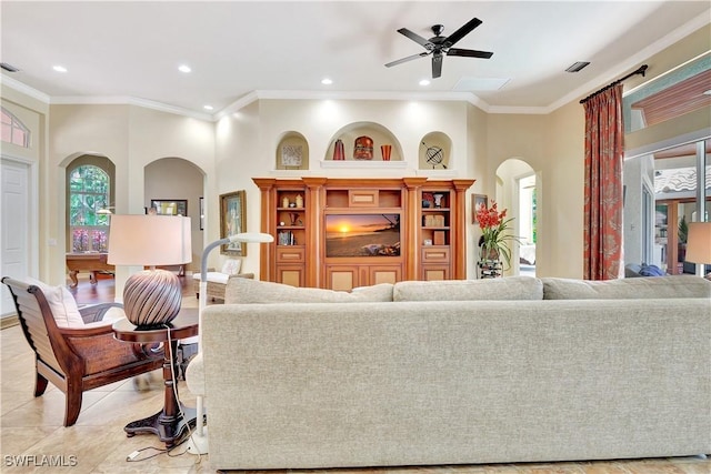 2363 Crayton Rd, Naples, FL 34103 - living area with arched walkways, a ceiling fan, crown molding, recessed lighting, and light tile patterned flooring