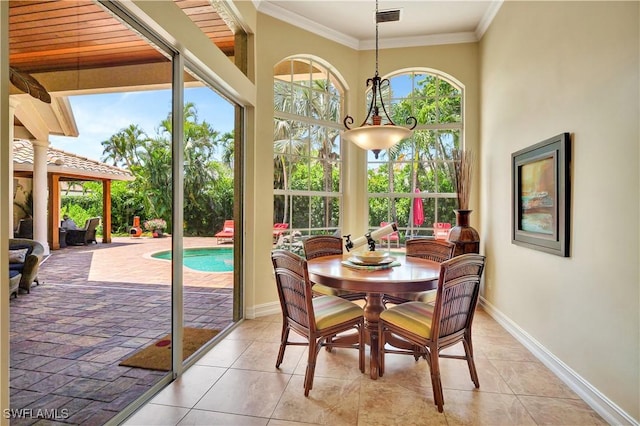 2363 Crayton Rd, Naples, FL 34103 - dining room with ornamental molding, baseboards, and light tile patterned floors