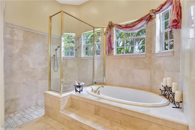 2363 Crayton Rd, Naples, FL 34103 - full bath featuring a garden tub, a walk in shower, and tile walls