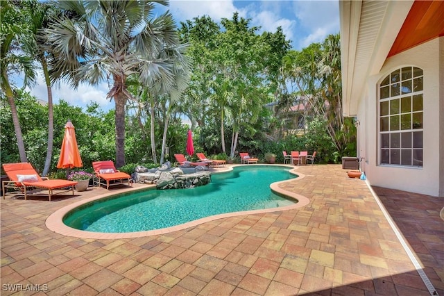 2363 Crayton Rd, Naples, FL 34103 - swimming pool with a patio