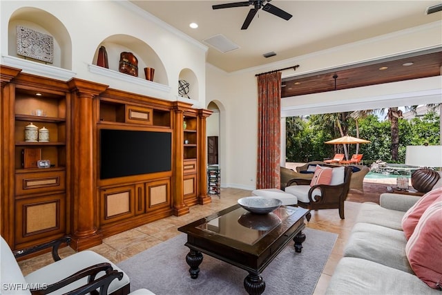2363 Crayton Rd, Naples, FL 34103 - living room featuring arched walkways, ceiling fan, crown molding, built in shelves, and recessed lighting