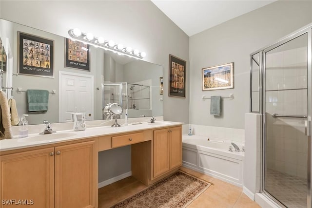 bathroom with a sink, a stall shower, a bath, double vanity, and tile patterned flooring