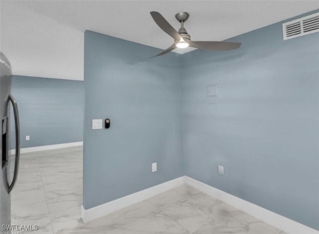 unfurnished room featuring visible vents, baseboards, a ceiling fan, and marble finish floor