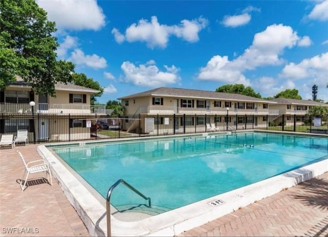 community pool featuring fence