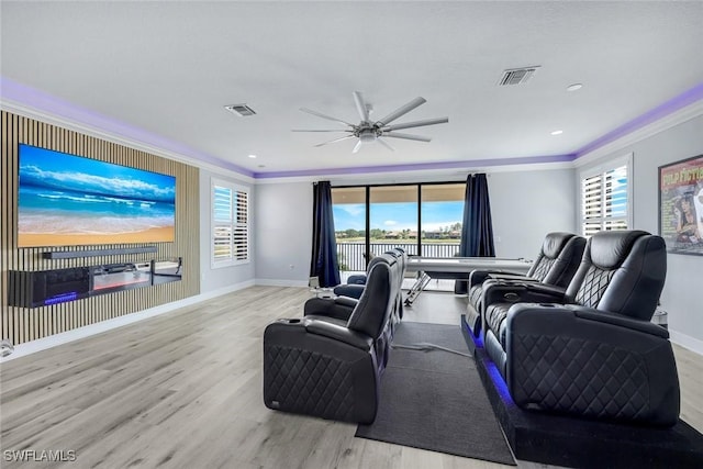 2927 Cinnamon Bay Cir, Naples, FL 34119 - living room featuring ornamental molding, baseboards, wood finished floors, a ceiling fan, and a water view