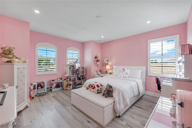 2927 Cinnamon Bay Cir, Naples, FL 34119 - bedroom with light wood-style floors, recessed lighting, and baseboards