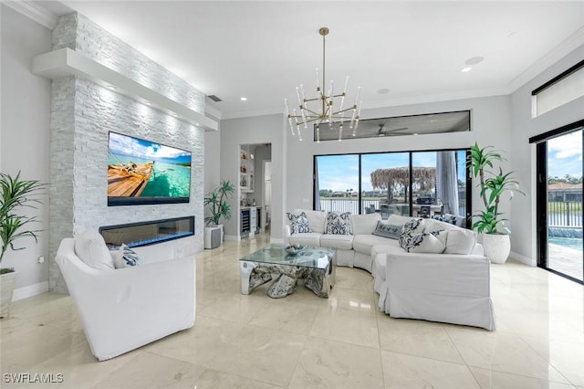 2927 Cinnamon Bay Cir, Naples, FL 34119 - living area featuring crown molding, a chandelier, a fireplace, baseboards, and recessed lighting