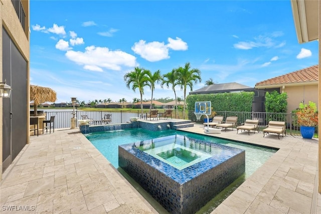 2927 Cinnamon Bay Cir, Naples, FL 34119 - view of pool featuring a patio, a water view, a pool with connected hot tub, and fence