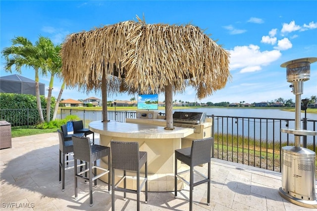 2927 Cinnamon Bay Cir, Naples, FL 34119 - view of patio with grilling area and a water view