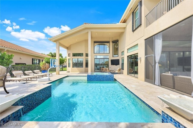 2927 Cinnamon Bay Cir, Naples, FL 34119 - view of pool featuring a patio, a pool with connected hot tub, and an outdoor hangout area