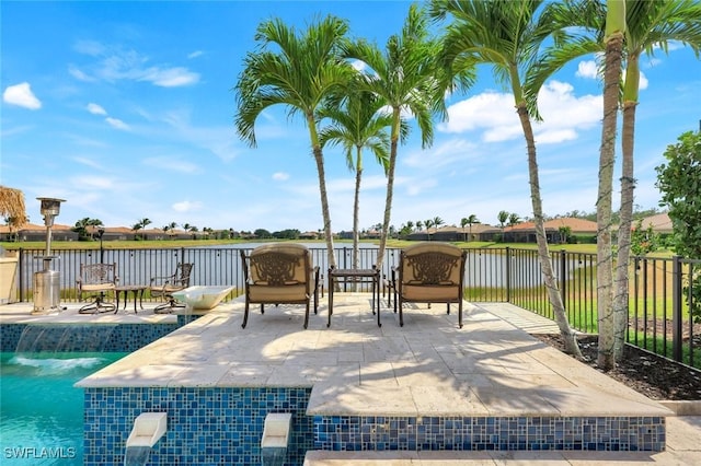 2927 Cinnamon Bay Cir, Naples, FL 34119 - view of patio / terrace with fence and a water view
