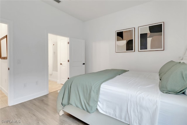 19657 Estero Pointe Ln, Fort Myers, FL 33908 - bedroom featuring wood finished floors and ensuite bathroom