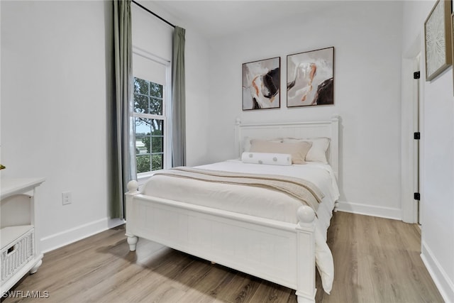 19657 Estero Pointe Ln, Fort Myers, FL 33908 - bedroom with wood finished floors and baseboards