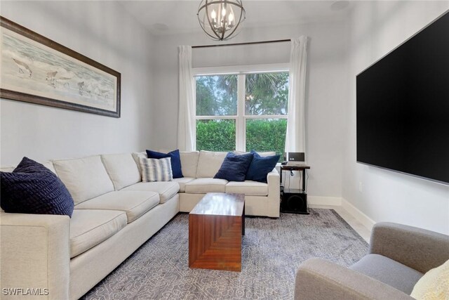 19657 Estero Pointe Ln, Fort Myers, FL 33908 - living area featuring a chandelier and baseboards
