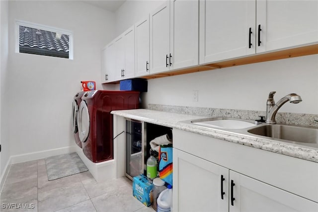 19657 Estero Pointe Ln, Fort Myers, FL 33908 - laundry room featuring cabinet space, washing machine and clothes dryer, and light tile patterned floors