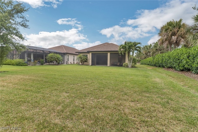 19657 Estero Pointe Ln, Fort Myers, FL 33908 - view of green lawn featuring a sunroom