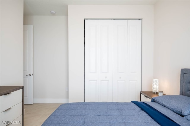 5590 Agostino Way, Ave Maria, FL 34142 - bedroom featuring a closet and baseboards
