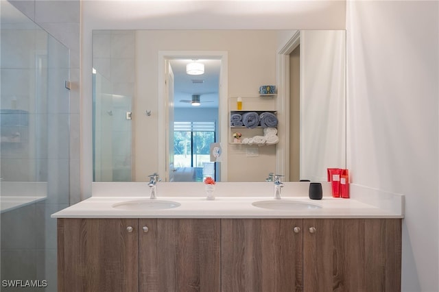ensuite bathroom featuring double vanity, ensuite bath, tiled shower, and a sink