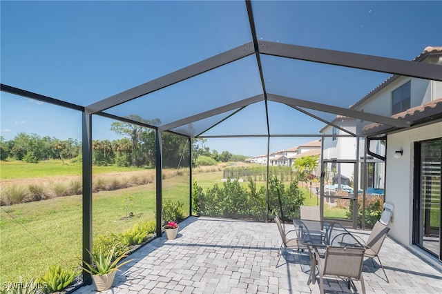 view of patio / terrace with a lanai