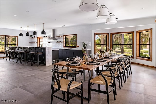 dining area with a wealth of natural light and baseboards