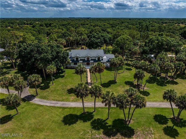 drone / aerial view with a view of trees