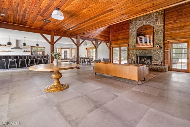6062 Sr-29, Immokalee, FL 34142 - living area featuring wooden ceiling, a fireplace, wood walls, and lofted ceiling