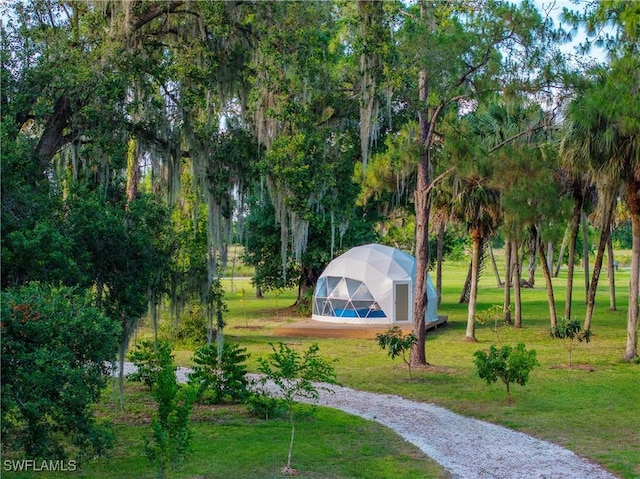 6062 Sr-29, Immokalee, FL 34142 - view of property's community with an exterior structure, a yard, an outbuilding, and driveway
