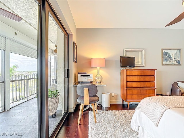 3399 Gulf Shore Blvd N Unit 605, Naples, FL 34103 - bedroom with access to exterior, wood finished floors, and baseboards