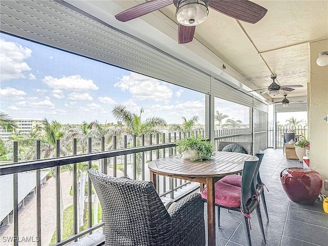 3399 Gulf Shore Blvd N Unit 605, Naples, FL 34103 - sunroom with a ceiling fan