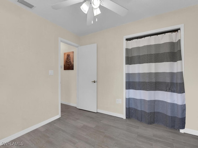 1210 Marlow St, Port Charlotte, FL 33952 - spare room with wood finished floors, baseboards, a ceiling fan, and visible vents