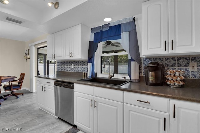 1210 Marlow St, Port Charlotte, FL 33952 - kitchen featuring stainless steel dishwasher, dark countertops, a sink, and visible vents