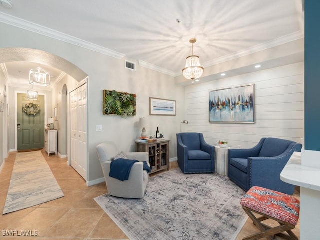 9834 Giaveno Cir Unit 1717, Naples, FL 34113 - living room featuring visible vents, arched walkways, a chandelier, and ornamental molding