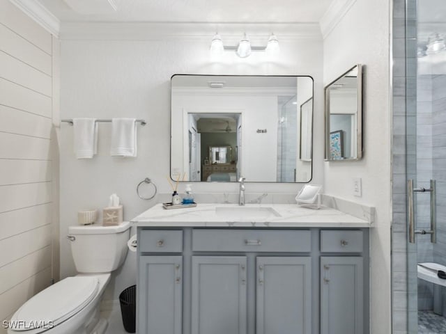 9834 Giaveno Cir Unit 1717, Naples, FL 34113 - bathroom with crown molding, toilet, vanity, and a stall shower