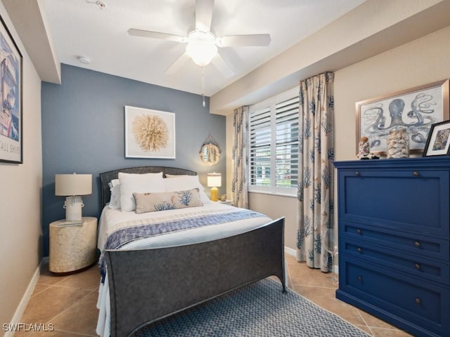 9834 Giaveno Cir Unit 1717, Naples, FL 34113 - bedroom featuring baseboards, a ceiling fan, and light tile patterned floors