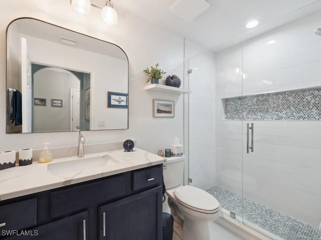 9834 Giaveno Cir Unit 1717, Naples, FL 34113 - full bath with vanity, toilet, recessed lighting, visible vents, and a stall shower