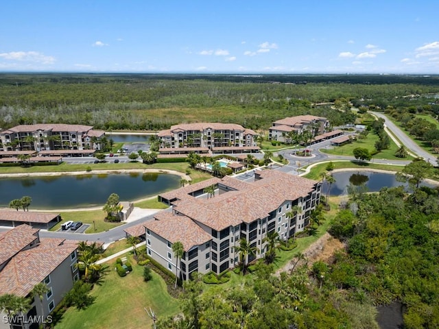 9834 Giaveno Cir Unit 1717, Naples, FL 34113 - aerial view featuring a water view and a wooded view