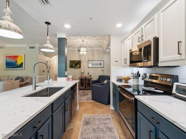 9834 Giaveno Cir Unit 1717, Naples, FL 34113 - kitchen featuring a sink, crown molding, stainless steel appliances, and open floor plan
