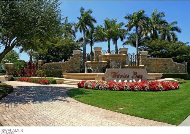 9834 Giaveno Cir Unit 1717, Naples, FL 34113 - community sign featuring a lawn