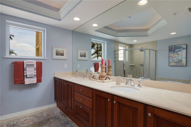 4761 W Bay Blvd Unit 303, Estero, FL 33928 - full bath with a tray ceiling, crown molding, double vanity, a stall shower, and baseboards